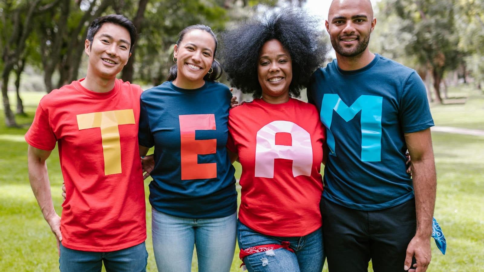 Group of People Wearing Shirts Spelled Team